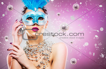 disco woman wearing silver accessories on purple backgound