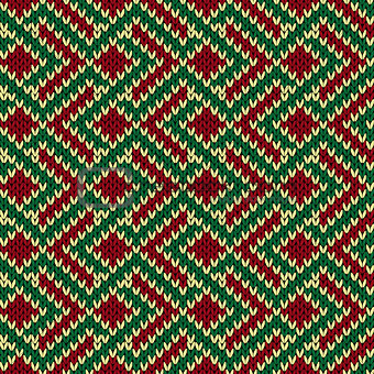 Seamless knitted pattern in red, green and beige colors