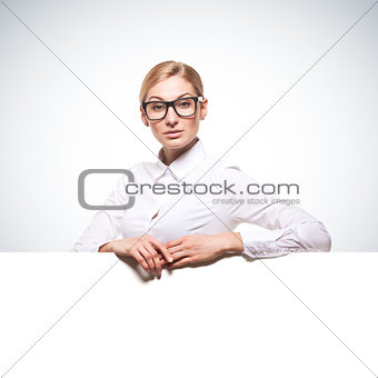 businesswoman holding a white billboard