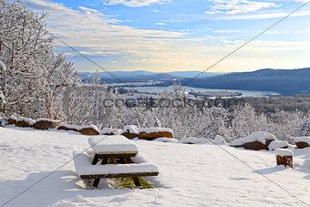 Snow Covered Picnic Table with a View
