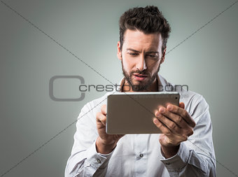 Attractive man using tablet
