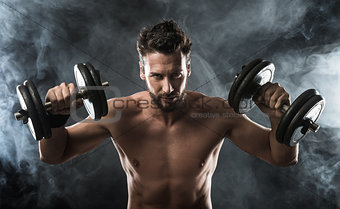 Attractive man weightlifting