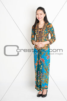 Southeast Asian woman in batik dress 