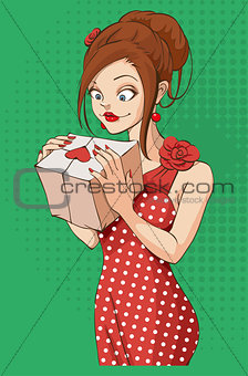 Beautiful young woman holding gift box on Valentines Day