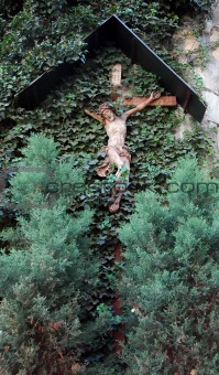 Cross  on the wall with leaves