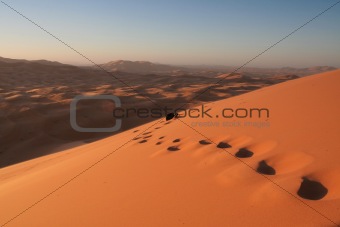 Footsteps in Erg Chebbi sand dunes