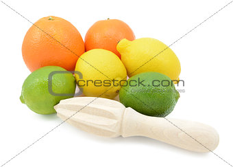 Six citrus fruits with a wooden reamer