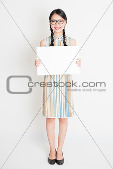 Oriental girl holding white paper card