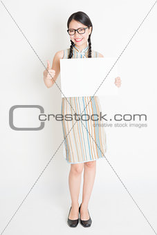Chinese female holding white blank paper card