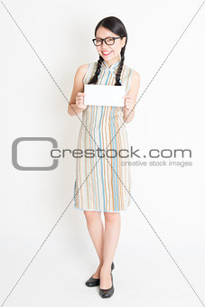 Asian woman holding white blank paper card