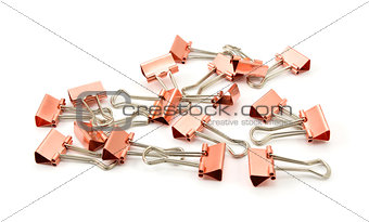 Copper-coloured metal binder clips