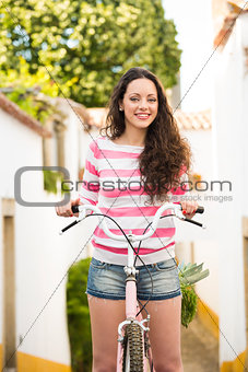 Happy girl riding a bicycle 