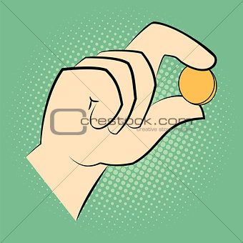 Hand holding a coin between two fingers