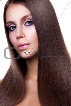 Beauty Woman with Very Long Healthy and Shiny Smooth Brown Hair.