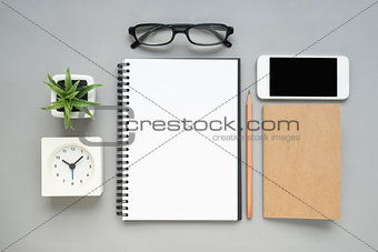 Table top view of office desk with stationery items