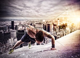 Workout  above the roof of a building in the city