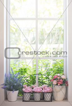 Artificial flowers on the window
