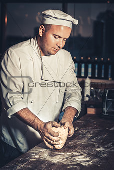 Busy chef at work in the restaurant kitchen