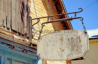 Blank vintage hanging shop front sign