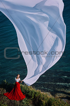 Beautiful Girl With White fabric on sea background