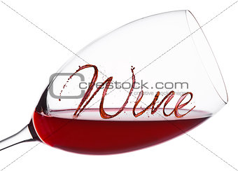 Glass of red wine with wine font splash and drops
