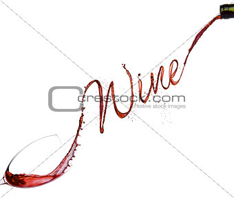 Pouring red wine from bottle to the glass 