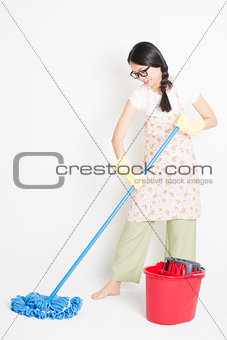 Asian Woman Cleaning floor