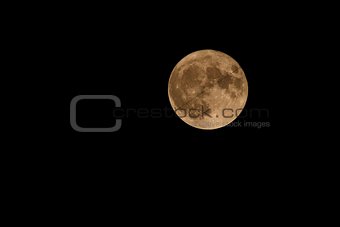 Full moon over dark black sky at night