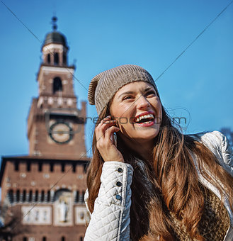 woman near Sforza Castle in Milan speaking on mobile phone