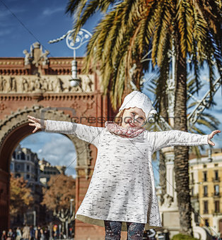 happy trendy girl in Barcelona, Spain rejoicing