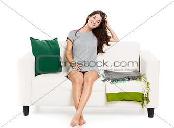 Beautiful woman relaxing on a sofa
