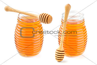 Honey in glass jar isolated on white background
