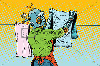 Vintage robot employee hangs up to dry clothes