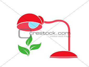 Table lamp warms a green plant 