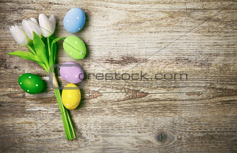 Easter eggs with bunch tulips copyspace