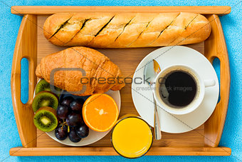 Continental breakfast on a tray from above a close-up shot