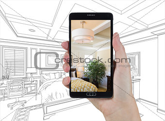 Hand Holding Smart Phone Displaying Photo of Bedroom Drawing Beh