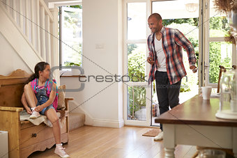 Girl Leaving Home For School With Father