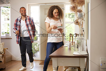 Couple In Hallway Returning Home Together
