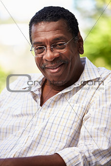 Outdoor Head And Shoulders Portrait Of Senior Man