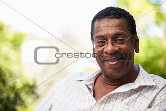 Outdoor Head And Shoulders Portrait Of Senior Man