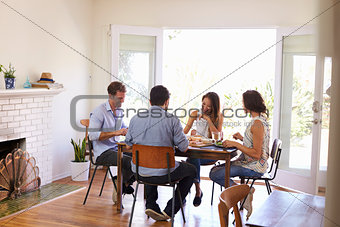 Group Of Friends Enjoying Dinner Party At Home Together