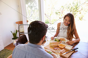 Couple Enjoying Meal At Home Together