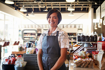 Portrait Of Female Employee Working In Delicatessen
