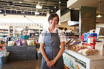 Portrait Of Female Employee Working In Delicatessen