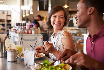Couple Enjoying Lunch Date In Delicatessen Restaurant
