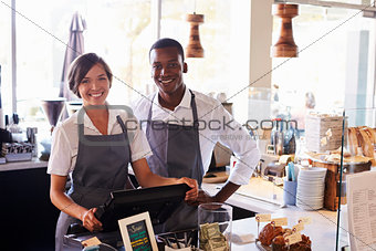 Portrait Of Staff Working At Delicatessen Checkout