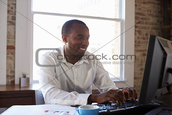 Businessman Working On Computer In Office