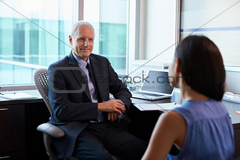 Doctor In Consultation With Female Patient In Office