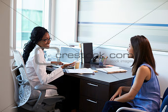 Doctor Wearing White Coat Meeting With Female Patient